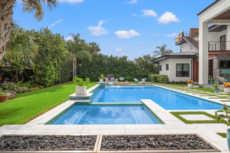 Newly built swimming pool with crystal clear water in a Jacksonville, FL, home.