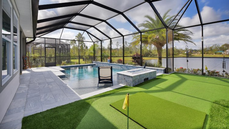 A modern golf simulator set up in a stylish home environment in Jacksonville, FL